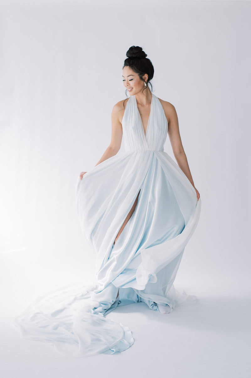 Whimsical and romantic sky blue chiffon halter neck wedding dress. Chiffon bow at the back. Slit on the left side. Catherine Langlois, Toronto, Canada.