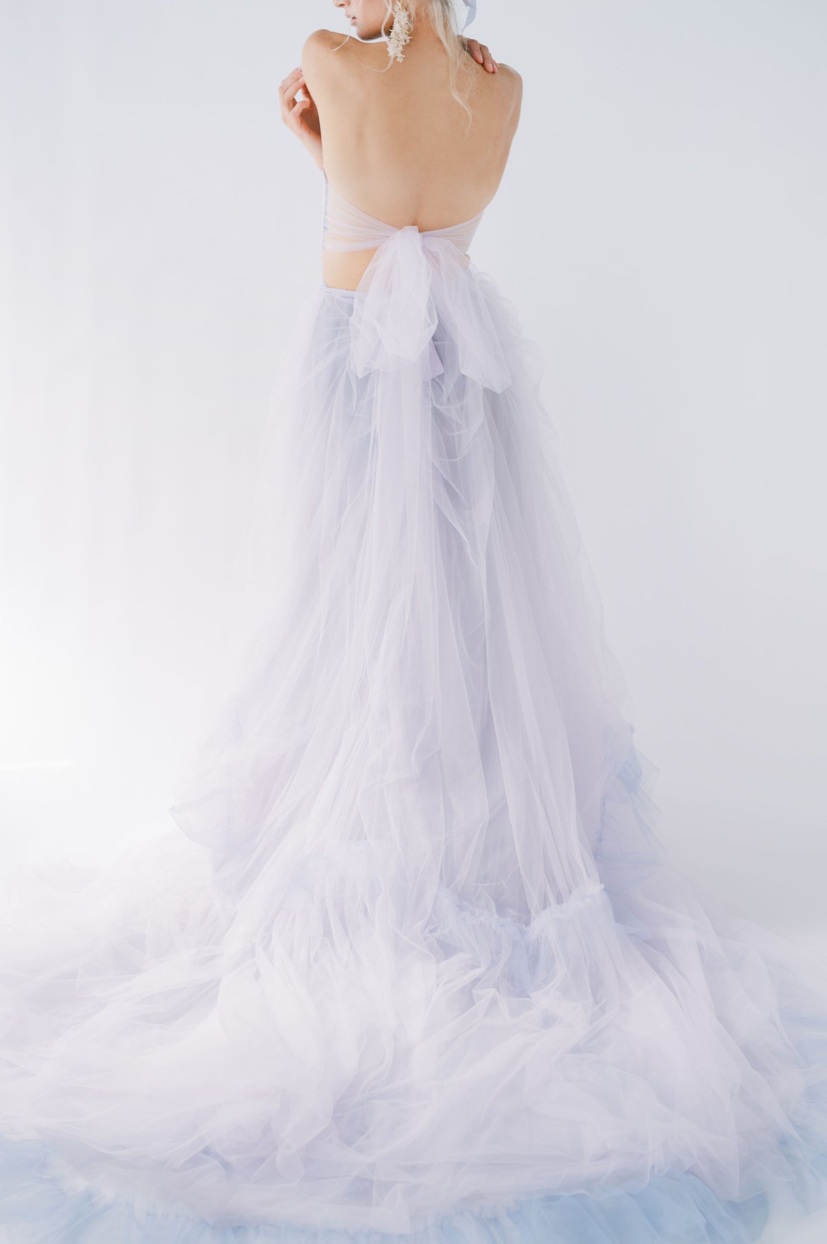 Ultimate whimsical romantic wedding dress. Lavender tulle, ruffled skirt. Three piece dress, overskirt, crop top with big tulle bow. By Catherine Langlois, Toronto