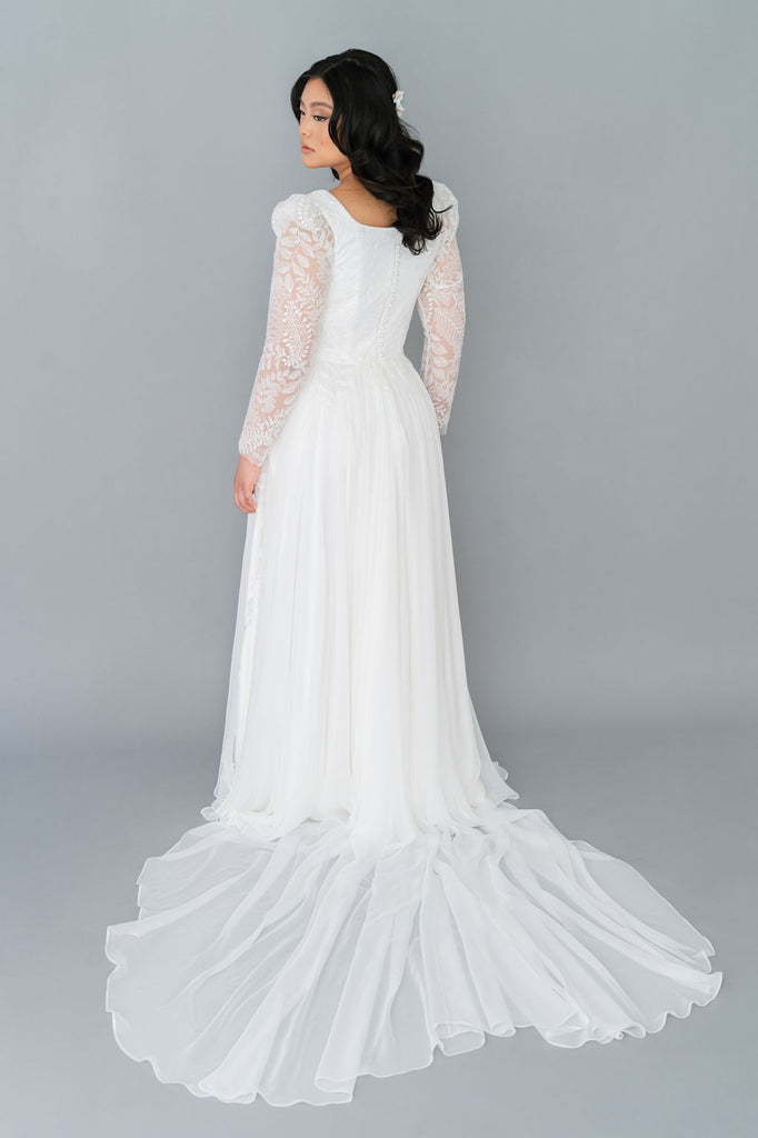 Romantic chiffon wedding dress with a square neckline. Full chiffon skirt, long lace sleeves, pearl buttons. Custom made by Catherine Langlois, Toronto.