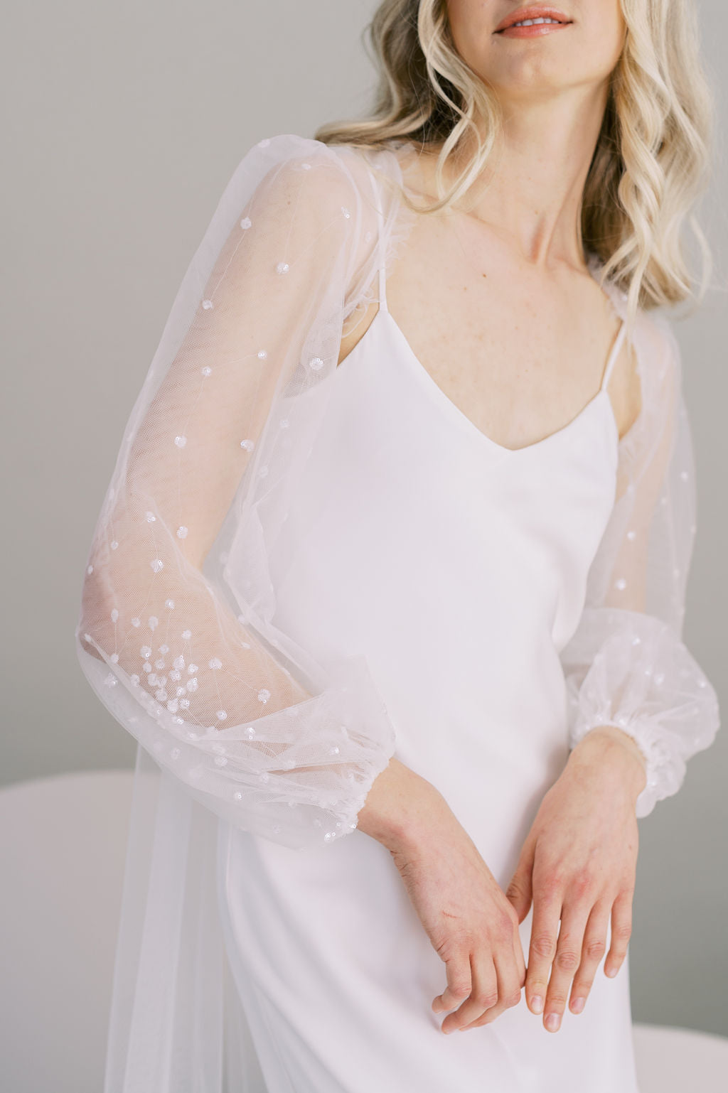 Long sequin bridal cape. Long poet sleeves. Handmade by Catherine Langlois, Toronto.