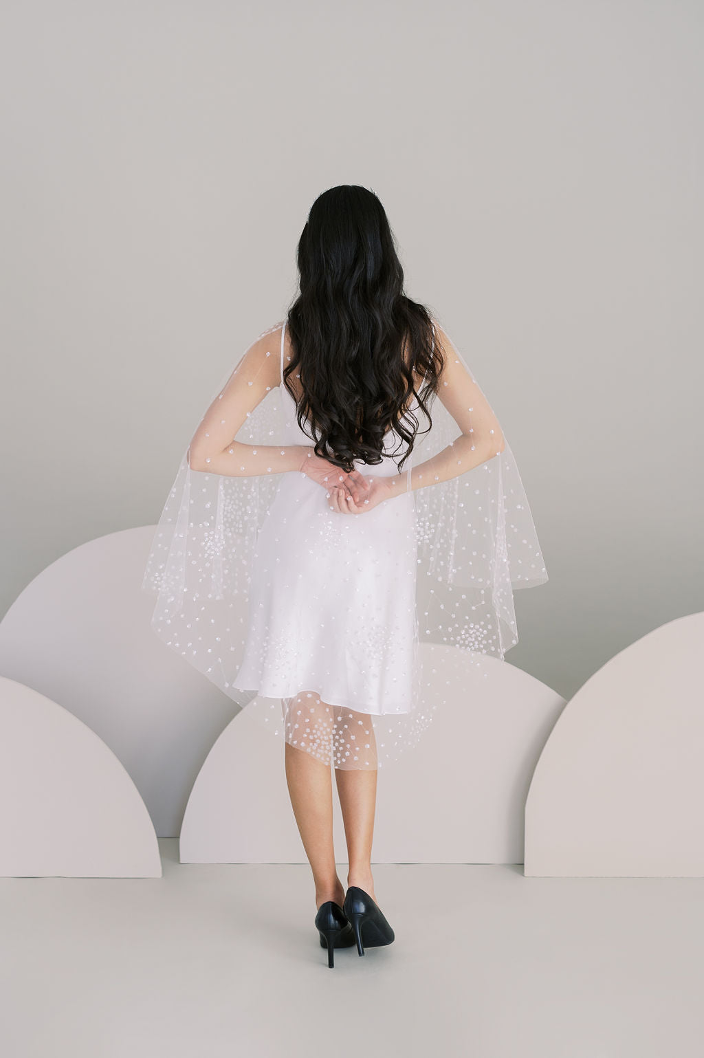 Celestial beaded tulle bridal cape. Waist length in front, knee length in back. Handmade by Catherine Langlois, Toronto, Canada.