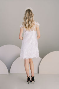 Knee length cotton boho lace wedding dress. A line with cap sleeves and crepe slip. Handmade by Catherine Langlois,Toronto, Canada.